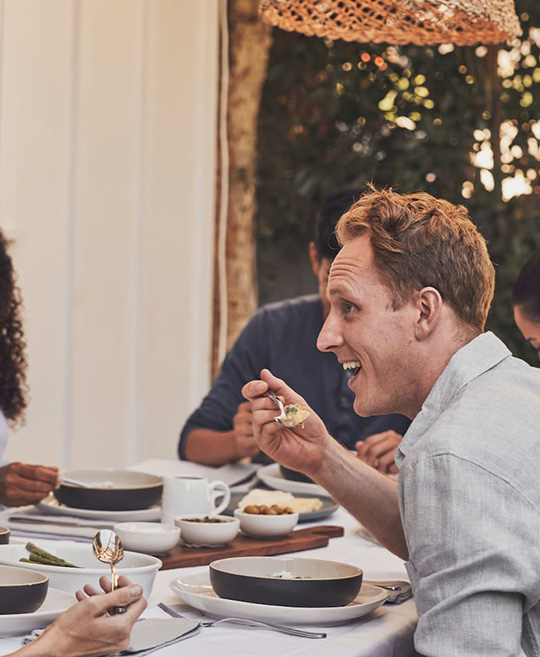 People eating dinner at a dining table