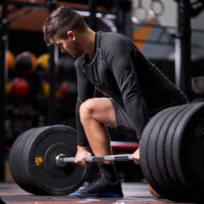 A man performs a deadlift