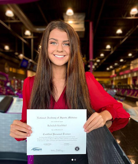 Woman holding a certificate