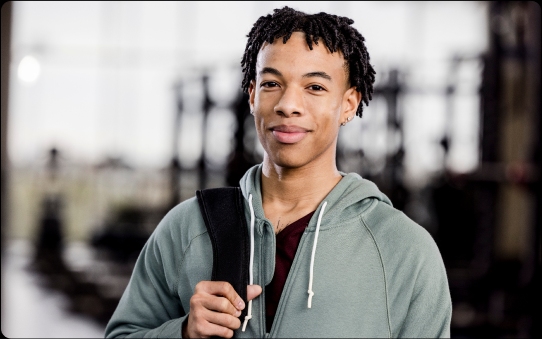 a man standing and smiling