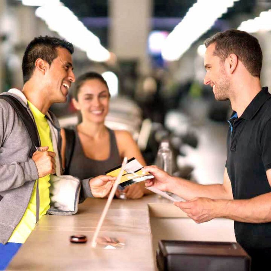 Male athlete talking to a male trainer