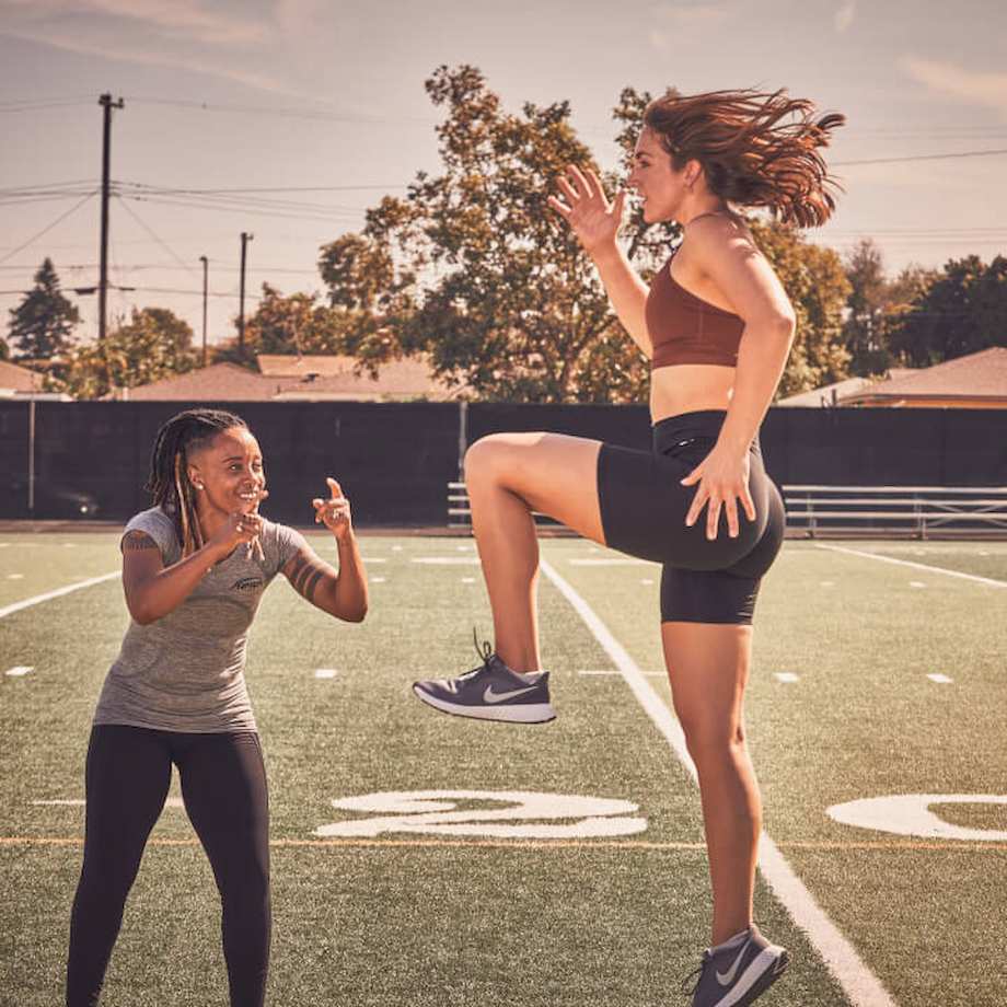 A woman helping a client with high steps