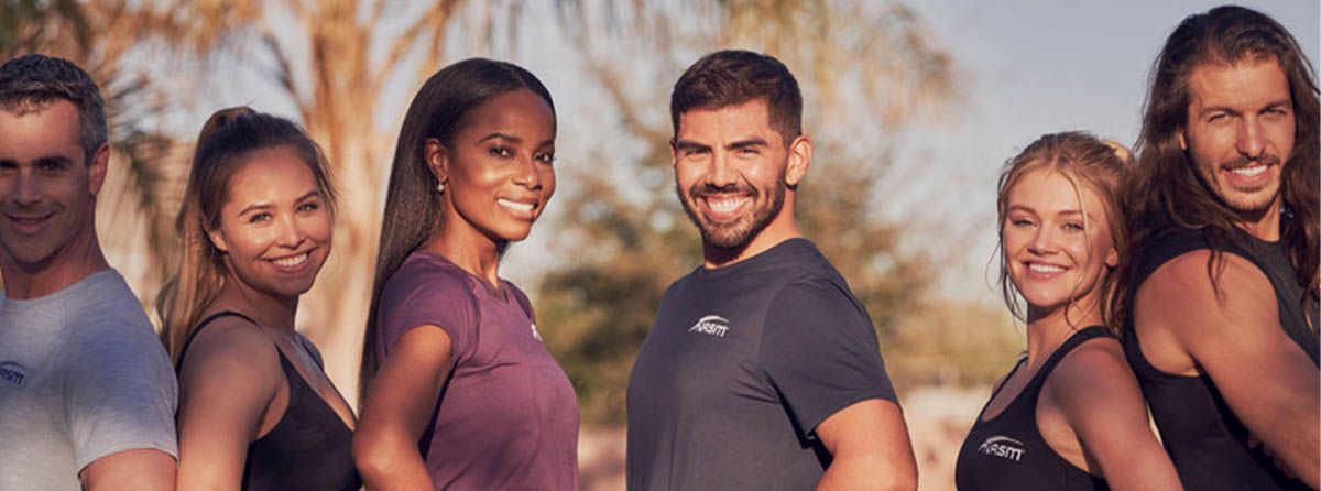 Group of NASM trainers smiling at camera