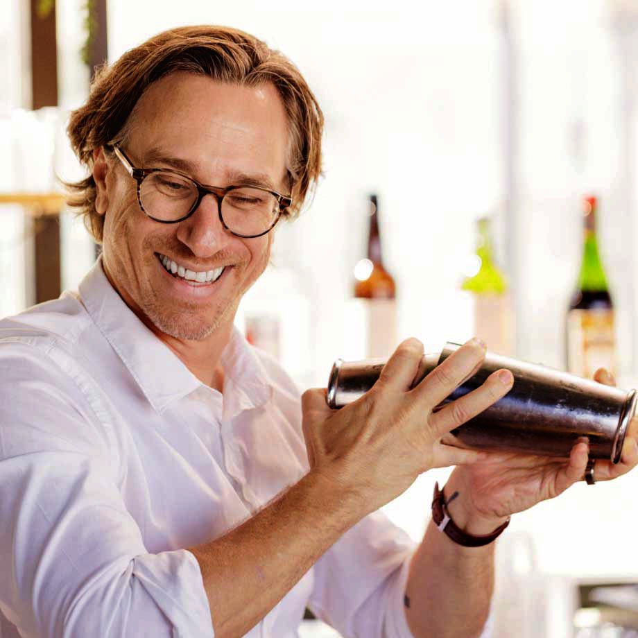 A male bartender making a drink