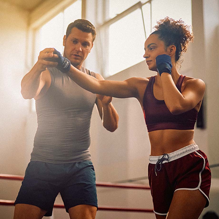 female client punching a male hand