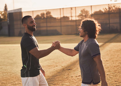 two males shaking hands