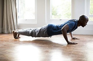 man using opt model for home workout